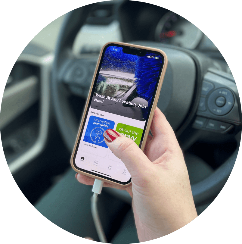 Woman's hand tapping on her phone while in vehicle